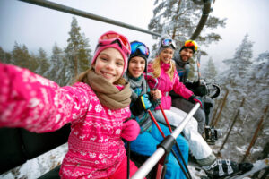 A family skiing on their Idaho winter vacation in Sandpoint.