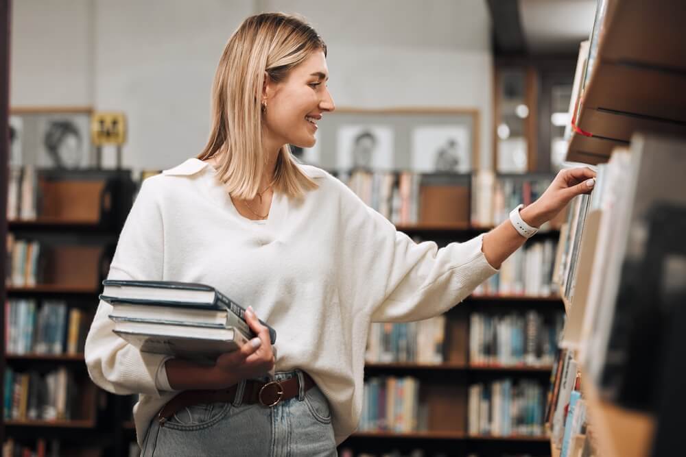 A woman shopping at a bookstore in Sandpoint.